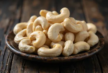 Raw, shelled cashew nuts on white background, natural arrangement
