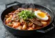 Tteokbokki with galbi, Korean rice cakes with spicy sauce, egg, and kimchi