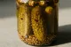 Spicy pickled cucumber seeds served in a jar