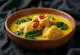 Egusi soup with chicken, rich spiced soup served with vegetables