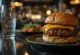 Sausage burger with cheese and vegetables