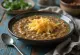 Smoked cheese lentil soup served