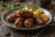 Beef kofta with roasted potatoes, garnished with fresh parsley