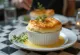 Thyme and cheese soufflé served