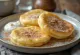Cinnamon Syrniki, golden brown cheese pancakes dusted with cinnamon