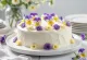 Spring cake decorated with edible flowers