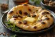 Cardamom and raisin naan bread served warm