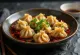 Chinese jiaozi dumplings in spicy chili oil served on a white porcelain plate