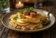 Layered potatoes with sausage, eggs, and sour cream topping.