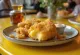 Golden brown fried cheese with crispy breading and lemon slices