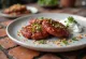 Rajma kebabs served with fresh vegetables and yogurt dip