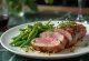 Sliced duck breast with green beans