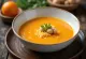 Ginger carrot soup served in a bowl