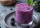 Probiotic blueberry kefir in a glass, pale purple shade, fruity drink
