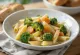 Creamy pasta with broccoli and carrots served in a bowl