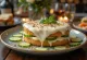 Smörgåstårta decorated with cucumber slices and fresh dill