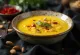 Golden Saffron Basundi in a bowl with pistachios