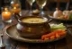 Warm Bagna Cauda dip served in a fondue pot with fresh vegetables