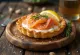 Karelian pies topped with smoked salmon, cream cheese, and fresh dill