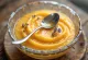 Lavender cantaloupe soup served in a glass bowl