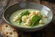 Creamy cauliflower and swiss chard soup served in a bowl