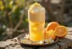 Orange-vanilla frappé with whipped cream and orange zest