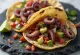 Grilled octopus tacos served