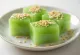 Green matcha kuzumochi with silky texture served with sesame seeds