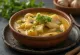 Vatapá de peixe com alho, fish cooked in creamy coconut milk served with lime and cilantro