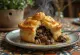 Pigeon pie served with golden crust.