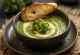 Cheesy broccoli soup served in a bowl