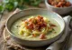 Creamy savoy cabbage soup with bacon served