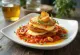 Classic Eggplant Parmesan with fresh basil, fried eggplant, and mozzarella