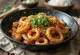 Osam-Bulgogi, spicy squid and pork dish with fresh green onions