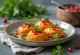 Pkhali with carrots, served with walnuts and fresh cilantro