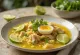 Soto Ayam with lime wedges and egg