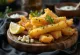 Yuca Frita with garlic sauce, served with parsley