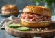 Bagel sandwich with smoked ham, cream cheese, and cucumber slices
