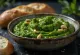 Wild garlic and cashew pesto in a jar, served with fresh ingredients