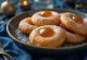 Golden brown doughnuts dusted with sugar and served with apricot jam
