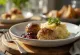 Swedish meatballs served with lingonberry jam and fresh herbs
