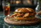 Pretzel sandwich filled with chicken breast fillets, crispy on the outside and soft on the inside.