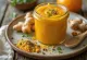 Zesty orange ginger curry sauce served in a glass bowl