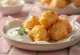 Coxinha served with creamy garlic sauce