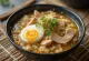 Chicken Arroz Caldo served with hard-boiled eggs, scallions, and fried garlic