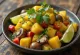 Ackee and mushrooms served with fresh cilantro and lime wedges
