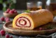 Raspberry liqueur Bolo de Rolo slice with fresh sauce