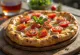 Tomato Manakish served with fresh herbs