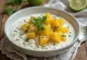 Tinda dahi with yogurt and cilantro, garnished with fresh lime leaf