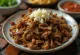 Carne Seca served with rice and fresh cilantro